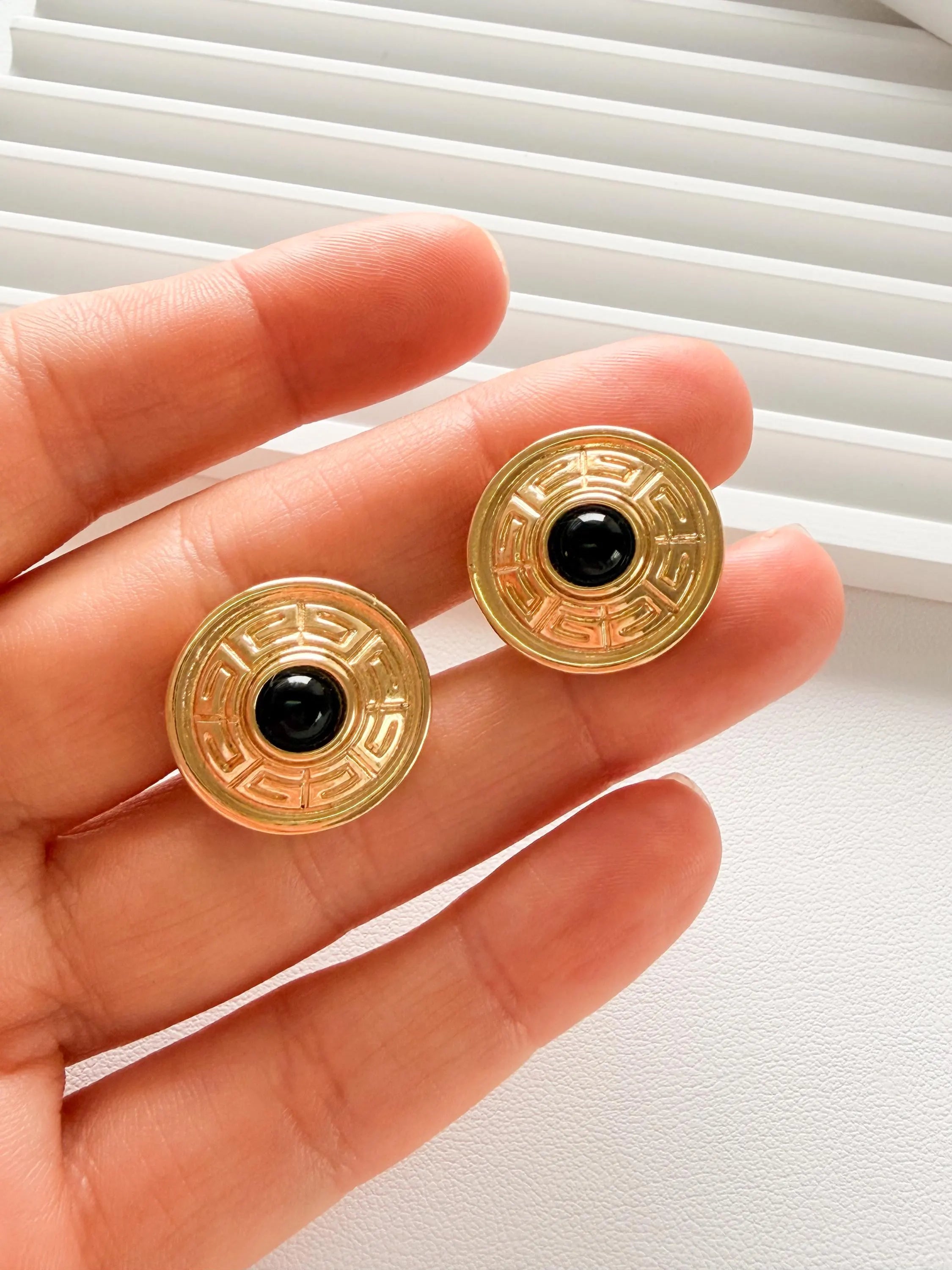 Elegant vintage Givenchy gold round clip on earrings refined timeless luxury jewelry, black cabochon