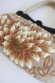 Detailed view of raised sculptural floral petals and dimensional beadwork on vintage Japanese evening handbag