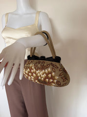 Vintage Japanese 3D floral beaded handbag carried by its elegant beaded top handle with ivory and champagne gold details
