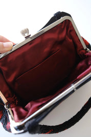 Interior view of vintage Japanese glass beaded handbag showing deep burgundy silk lining