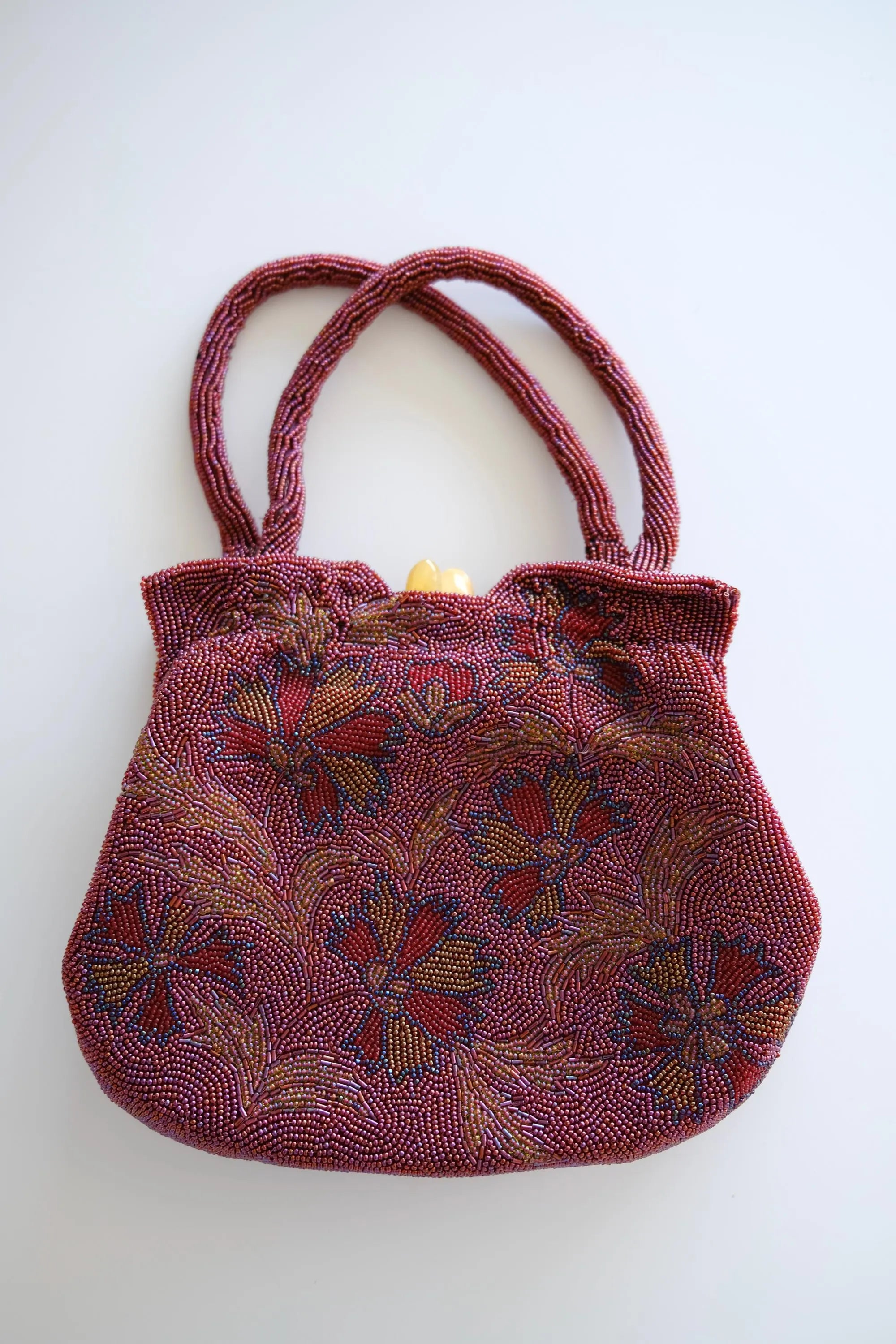 Vintage Japanese burgundy glass beaded floral evening handbag with double beaded handles and amber-tone clasp