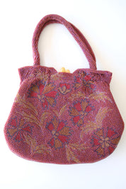 Front view of vintage Japanese wine-red glass beaded handbag featuring intricate floral embroidery in red, blue, gold and green