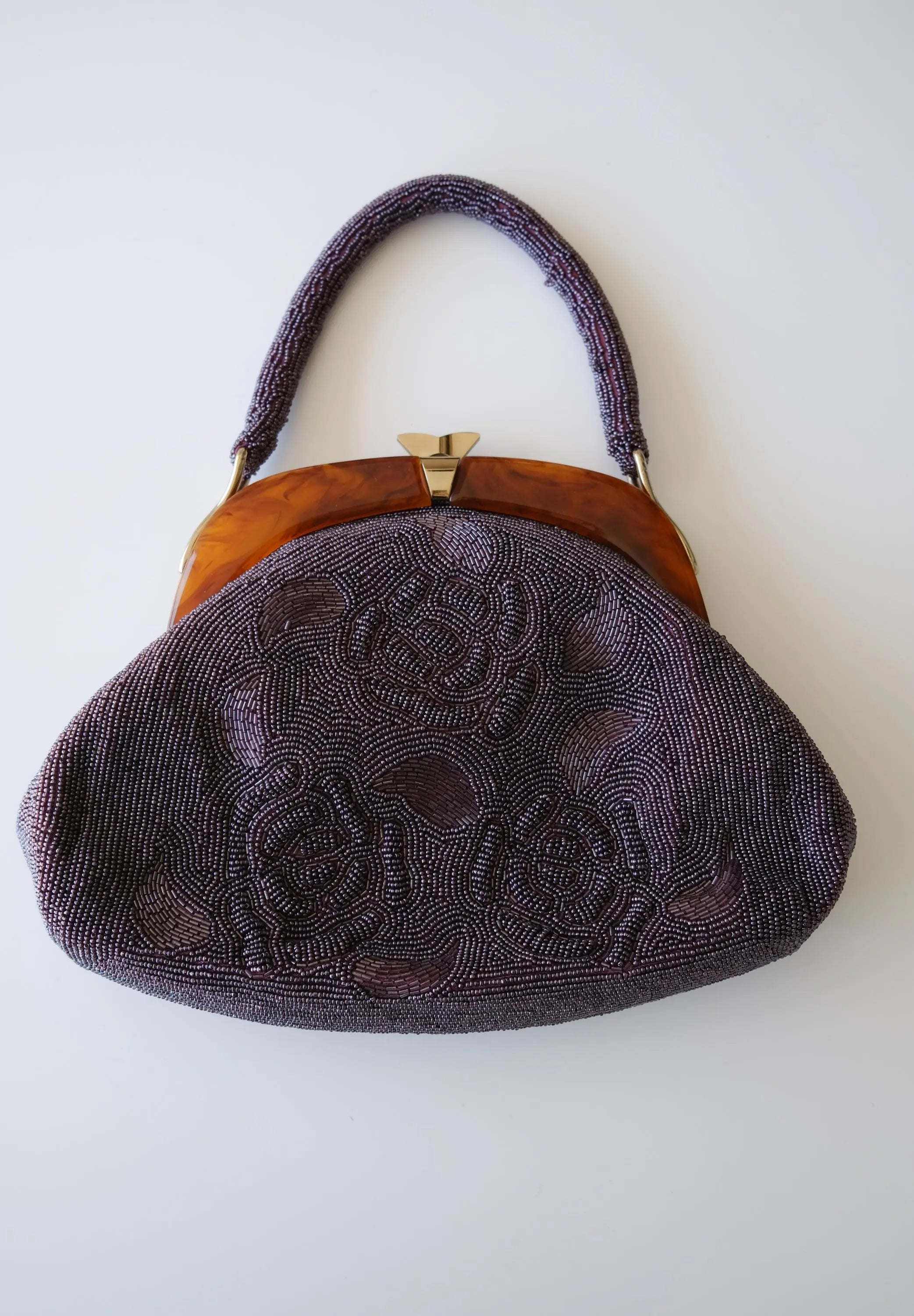 Vintage Japanese purple glass beaded evening handbag with raised 3D rose floral embroidery, amber-tone frame and beaded top handle