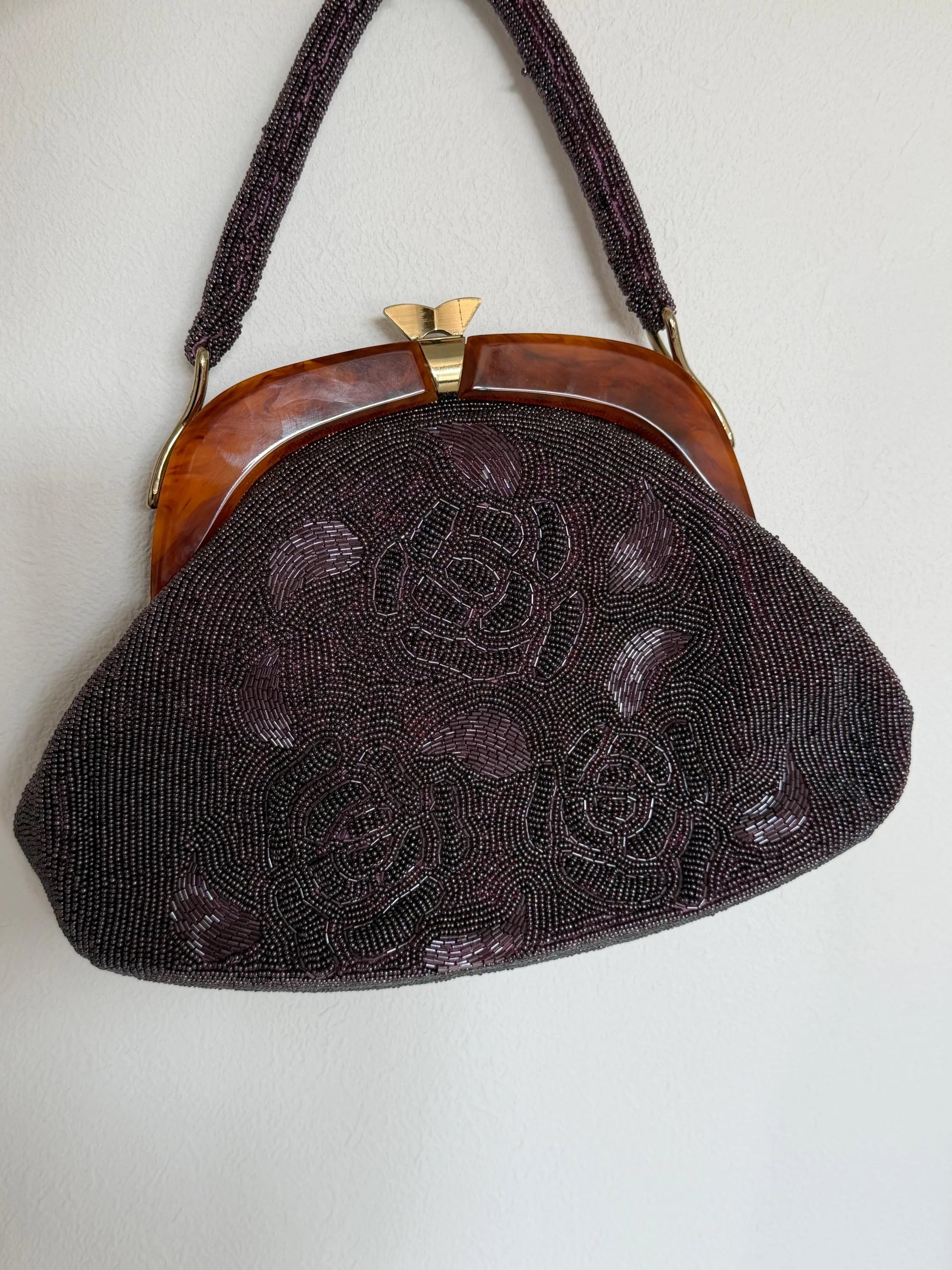Vintage Japanese purple glass beaded evening handbag with raised 3D rose floral embroidery, amber-tone frame and beaded top handle