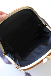 Interior view of vintage Japanese purple glass beaded handbag featuring black satin lining