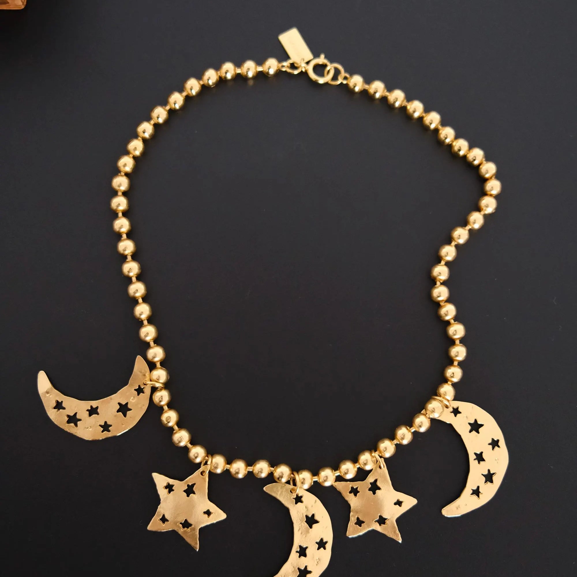 Vintage KENZO Paris gold-tone celestial charm necklace with dangling crescent moon and star pendants