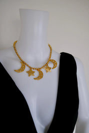 Vintage KENZO Paris gold-tone celestial charm necklace with dangling crescent moon and star pendants