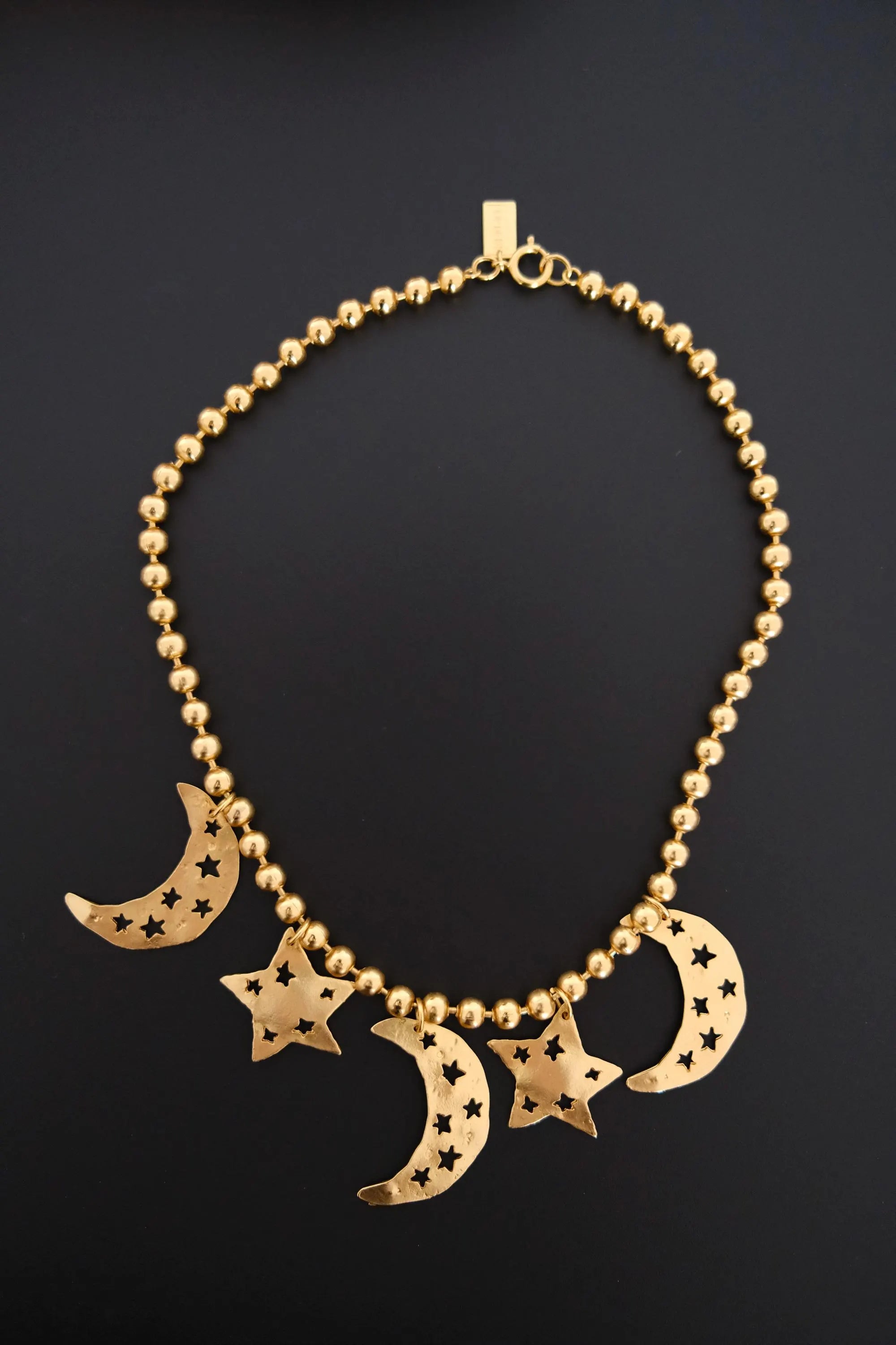 Vintage KENZO Paris gold-tone celestial charm necklace with dangling crescent moon and star pendants