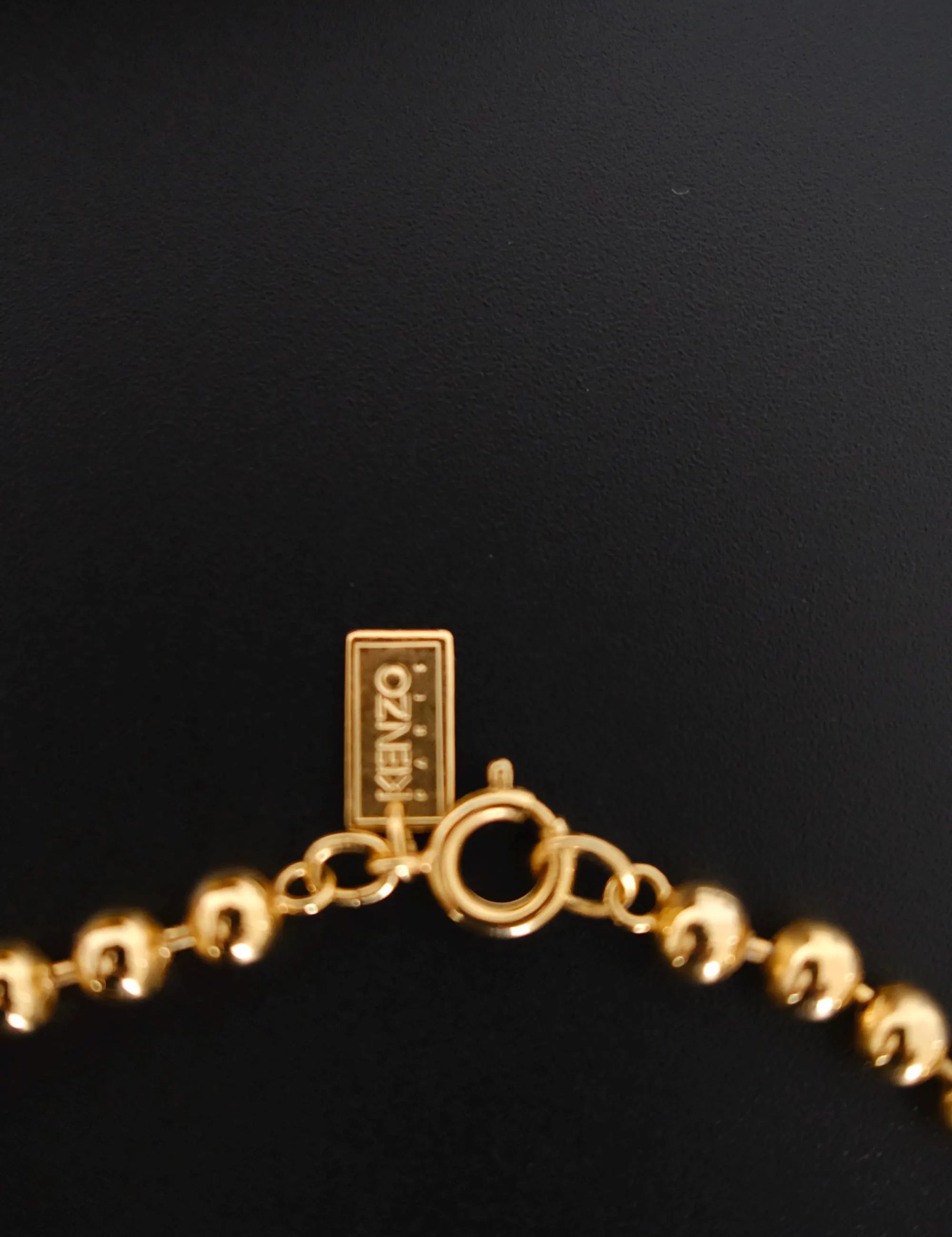 Vintage KENZO Paris gold-tone celestial charm necklace with dangling crescent moon and star pendants
