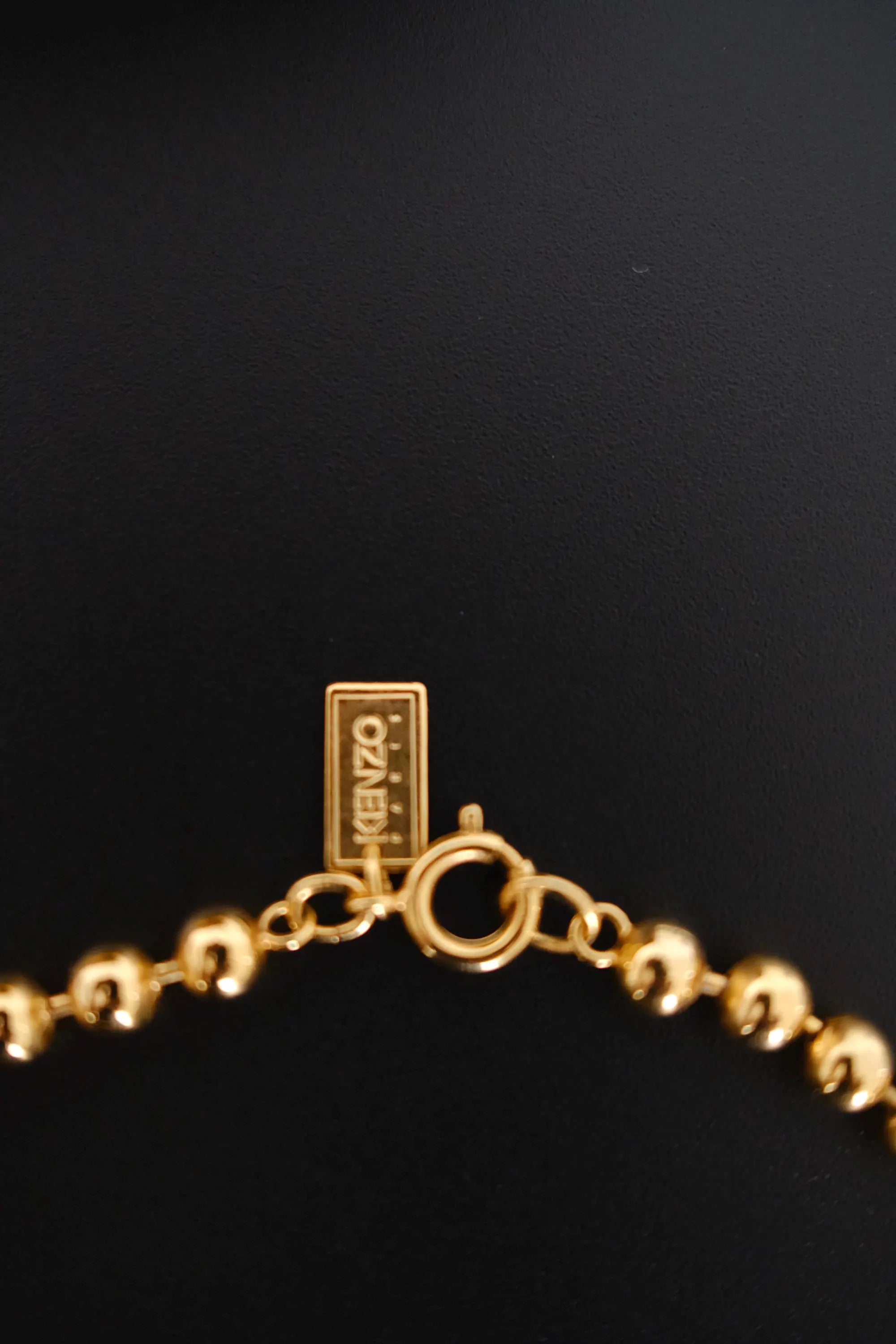 Vintage KENZO Paris gold-tone celestial charm necklace with dangling crescent moon and star pendants