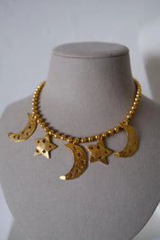 Vintage KENZO Paris gold-tone celestial charm necklace with dangling crescent moon and star pendants