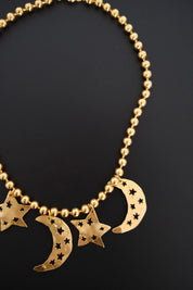 Vintage KENZO Paris gold-tone celestial charm necklace with dangling crescent moon and star pendants