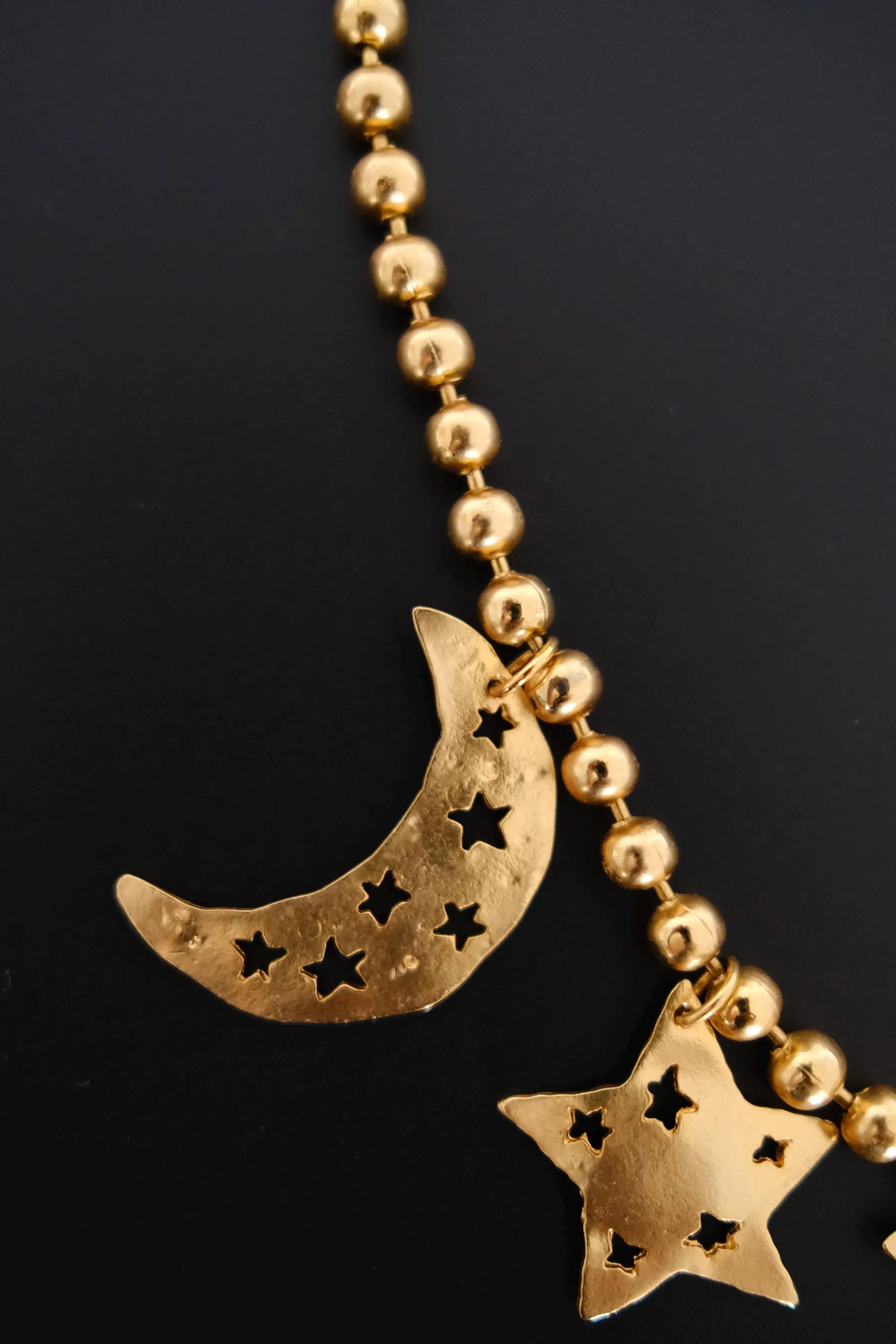 Vintage KENZO Paris gold-tone celestial charm necklace with dangling crescent moon and star pendants