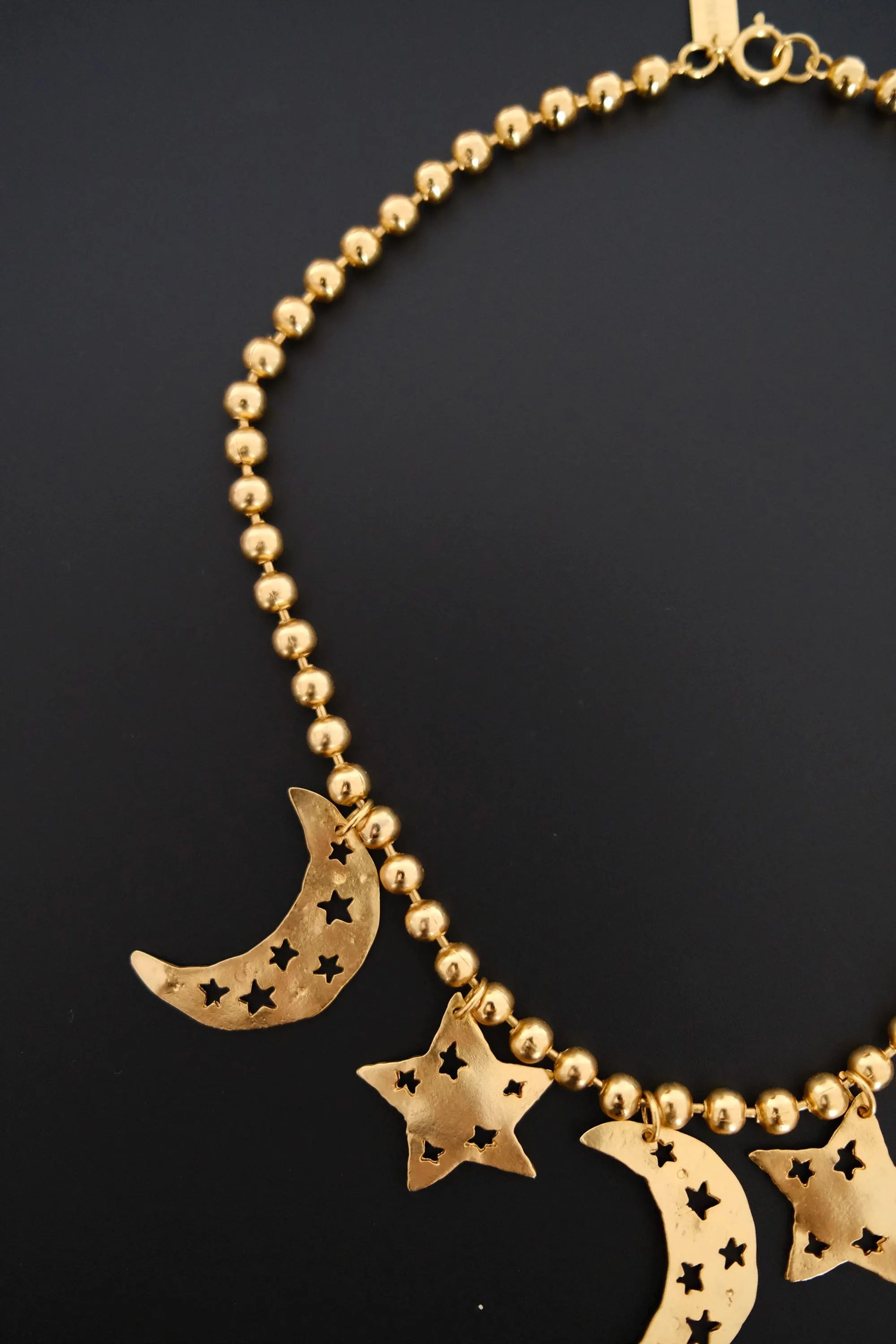 Vintage KENZO Paris gold-tone celestial charm necklace with dangling crescent moon and star pendants