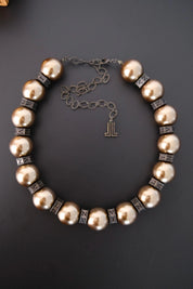 Vintage Lanvin statement necklace with large champagne faux pearls and LL logo charm