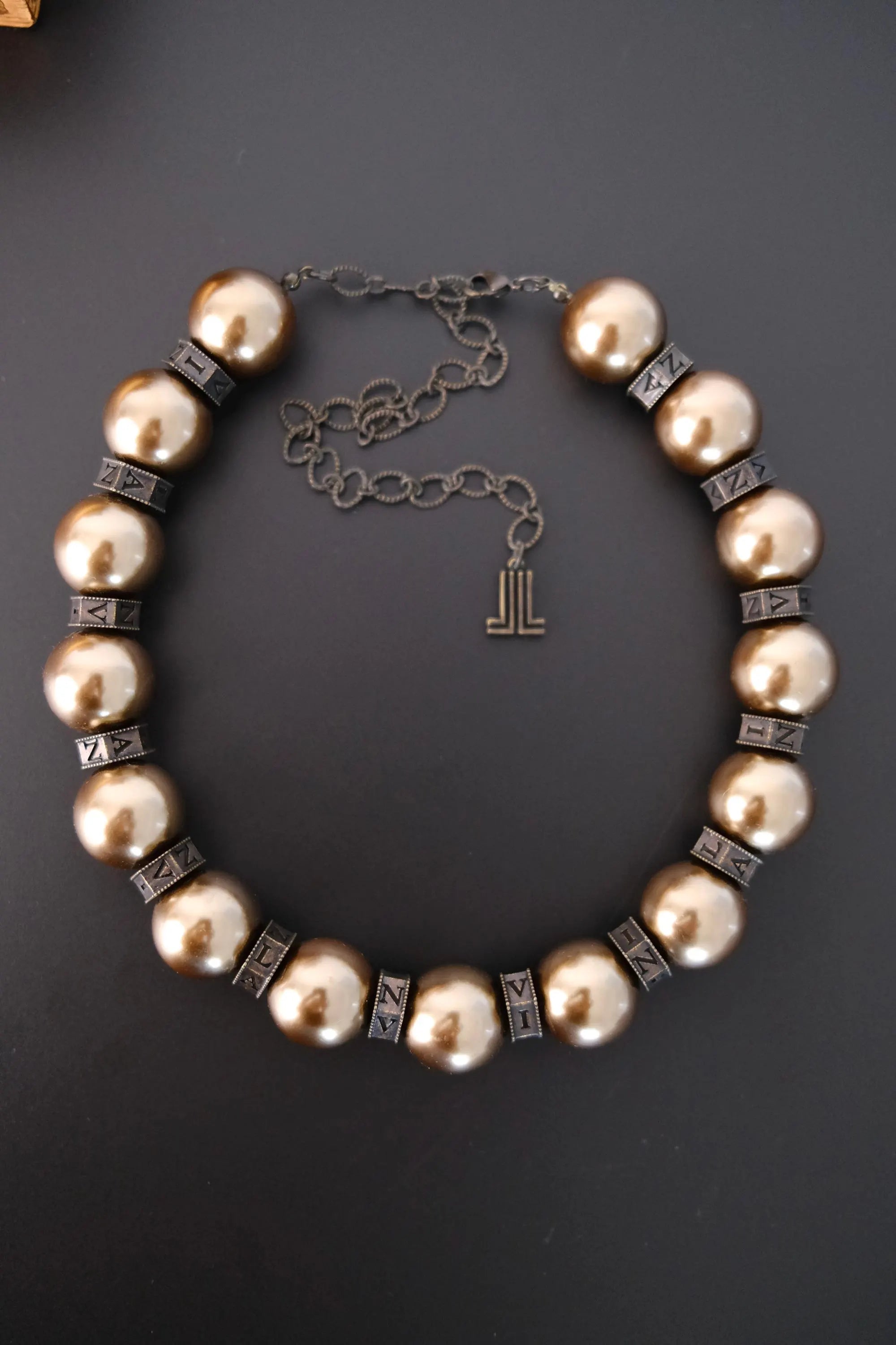 Vintage Lanvin statement necklace with large champagne faux pearls and LL logo charm