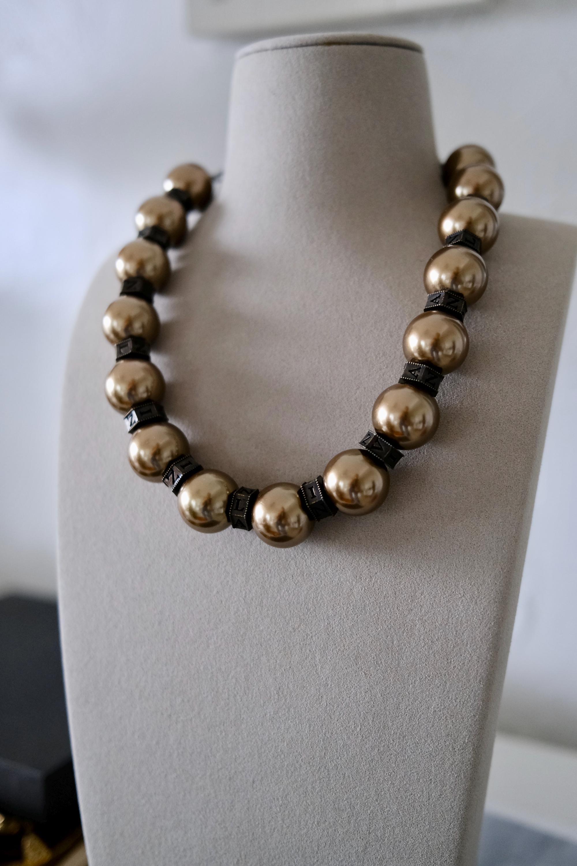 Vintage Lanvin statement necklace with large champagne faux pearls and LL logo charm
