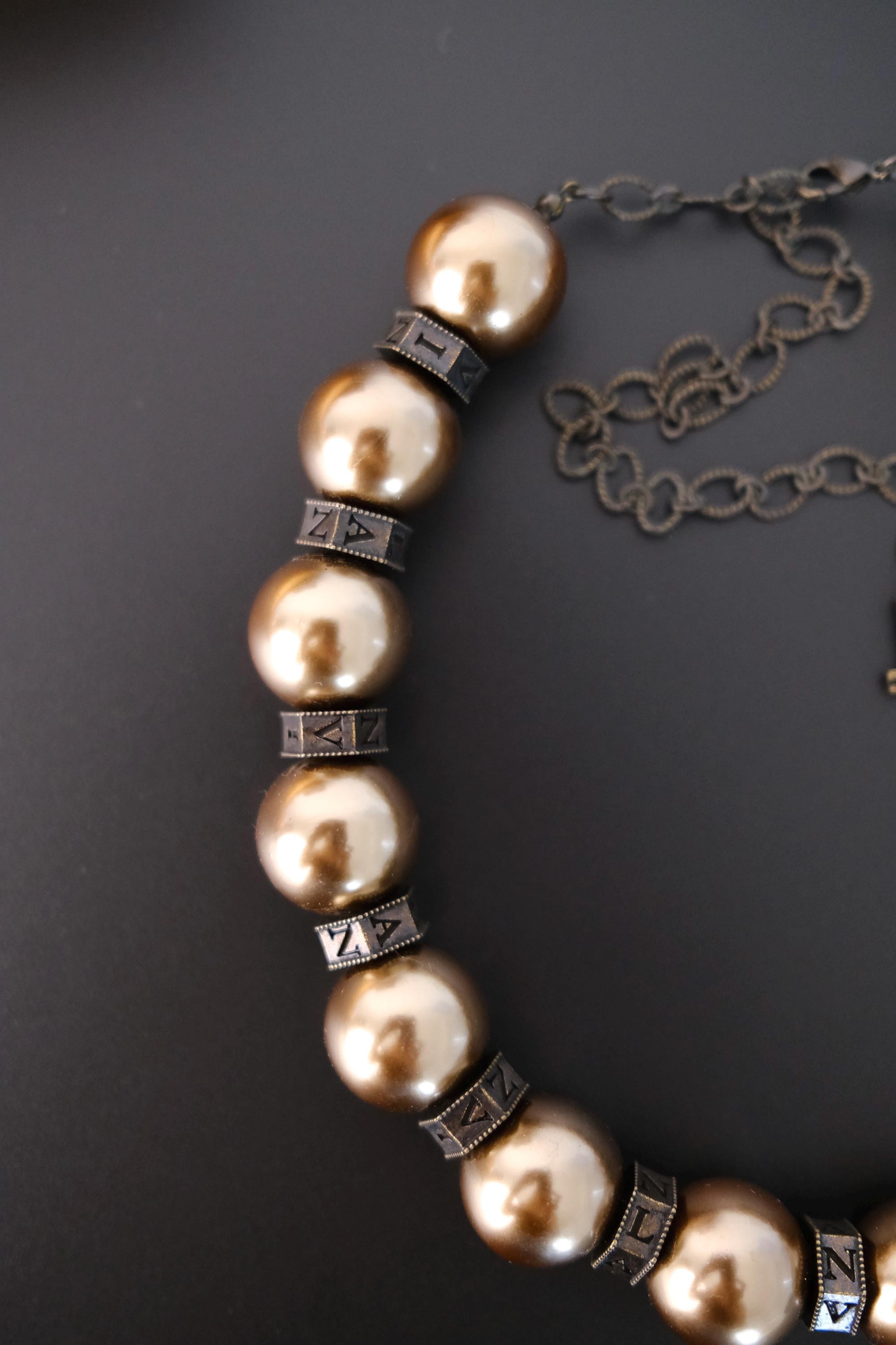 Vintage Lanvin statement necklace with large champagne faux pearls and LL logo charm