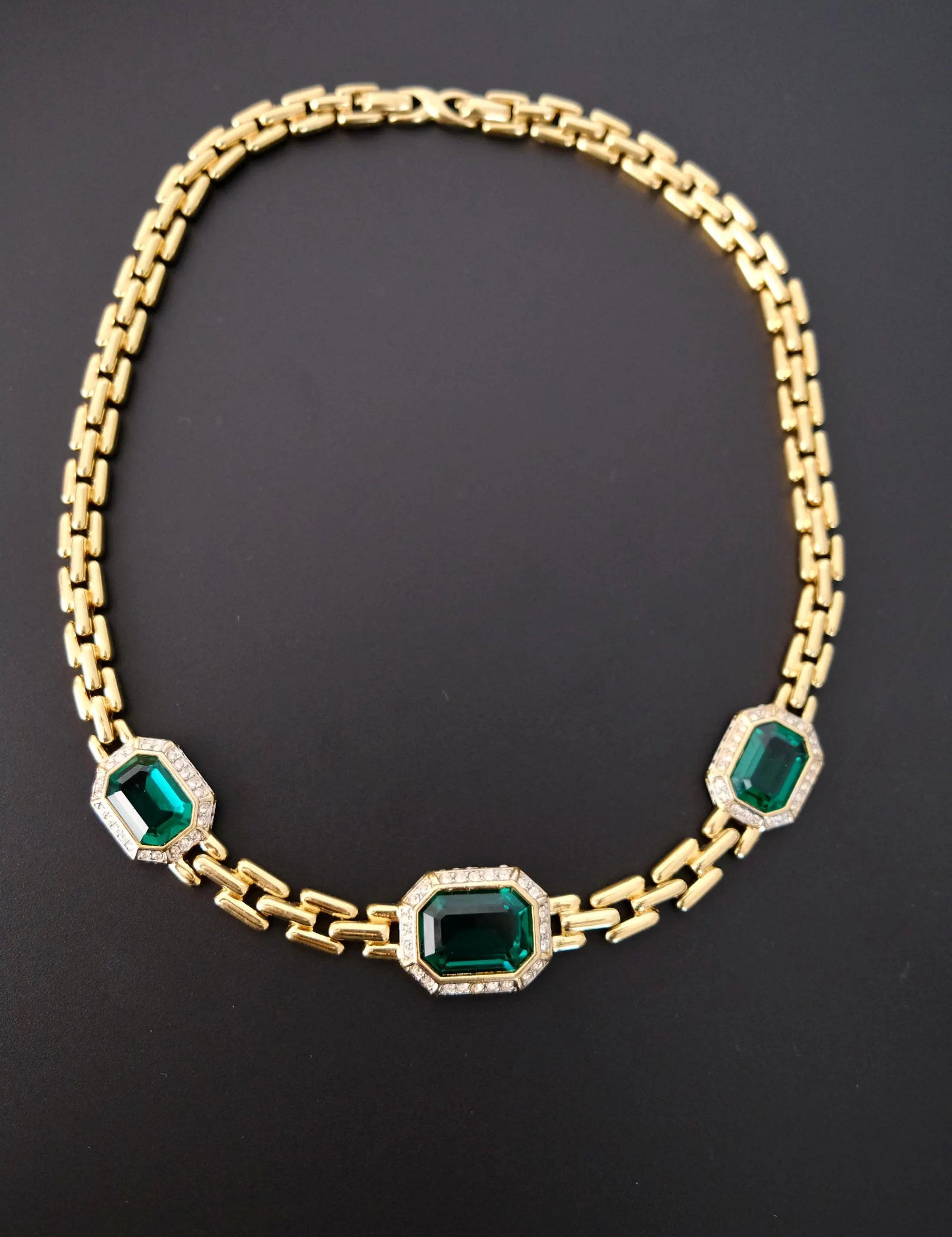 Vintage 1980s Nina Ricci emerald green choker necklace with gold-tone chain and crystal accents
