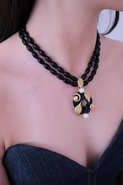 Elegant vintage Nina Ricci black glass bead choker necklace gold leaf pearl pendant luxury