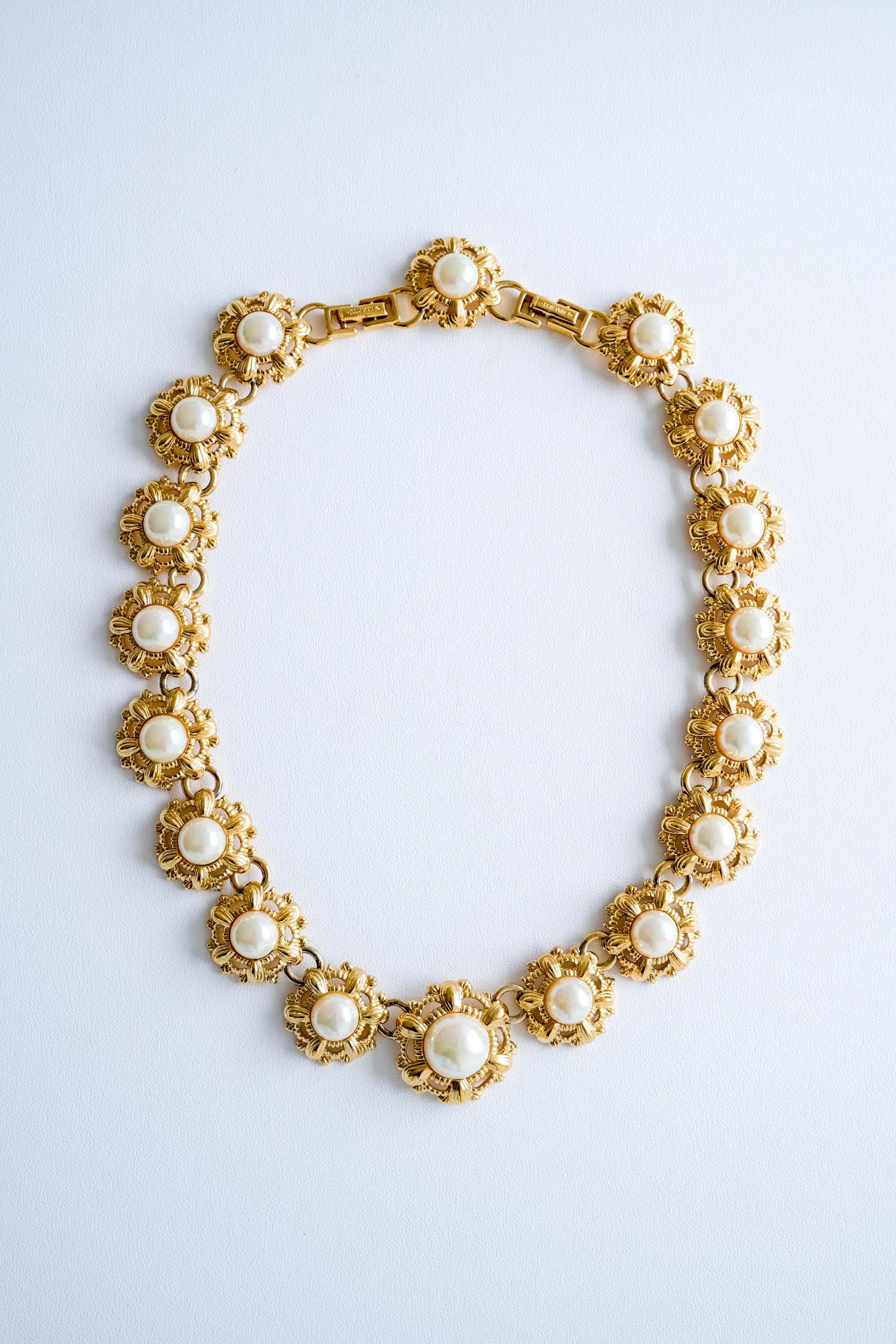 Elegant vintage Nina Ricci gold floral faux pearl choker refined Parisian luxury