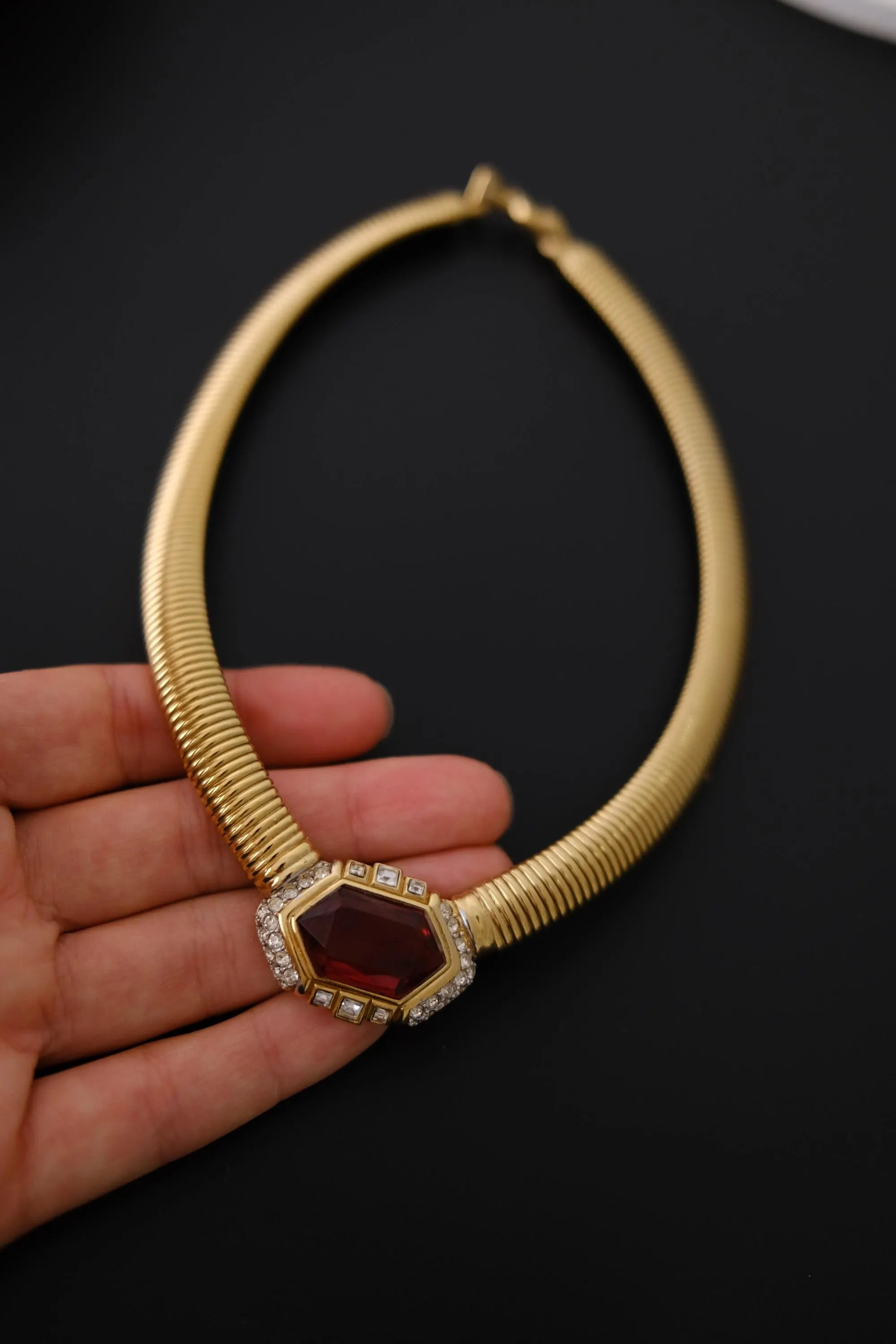 Excellent vintage condition Nina Ricci gold-tone Tubogas necklace with faceted ruby-red glass and sparkling clear crystals