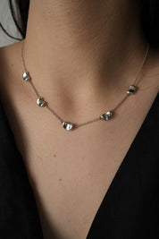Vintage Tiffany & Co Elsa Peretti Five Bean necklace in sterling silver 925 featuring five polished sculptural Bean motifs