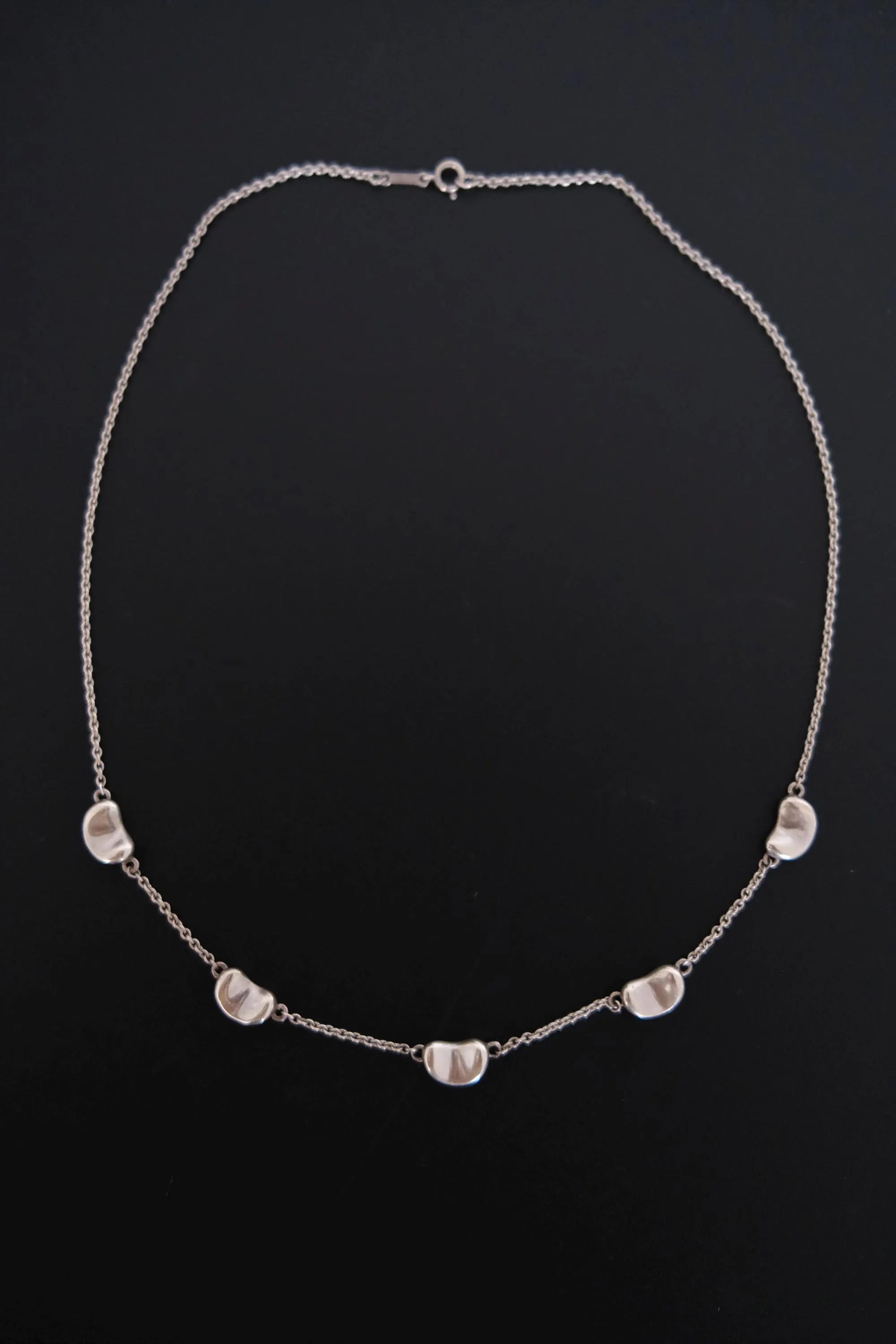 Near excellent vintage condition Tiffany & Co Elsa Peretti Five Bean necklace showing polished sterling silver finish and light signs of previous wear