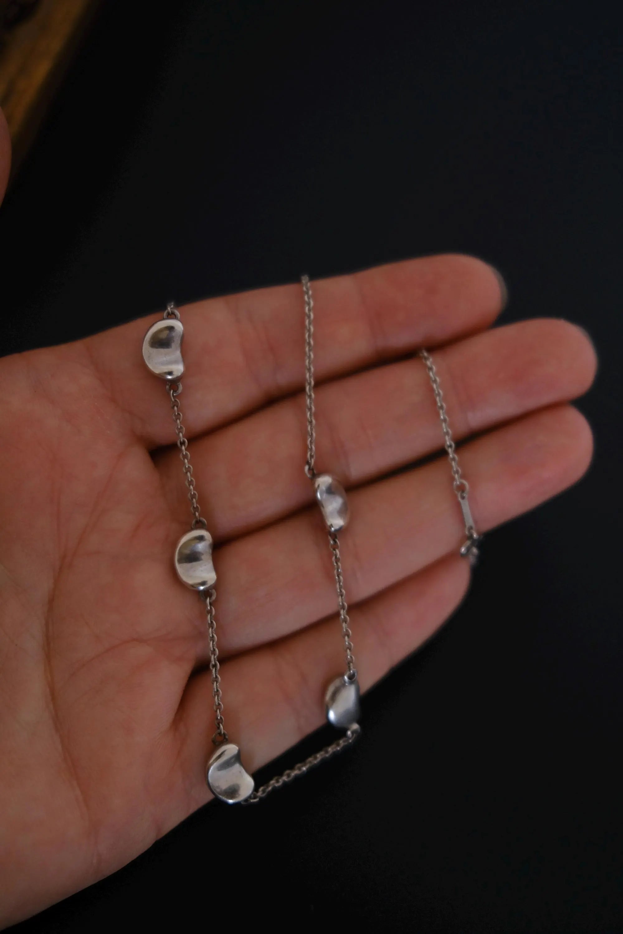 Vintage Tiffany & Co Elsa Peretti Five Bean sterling silver necklace measuring approximately 41 cm in length