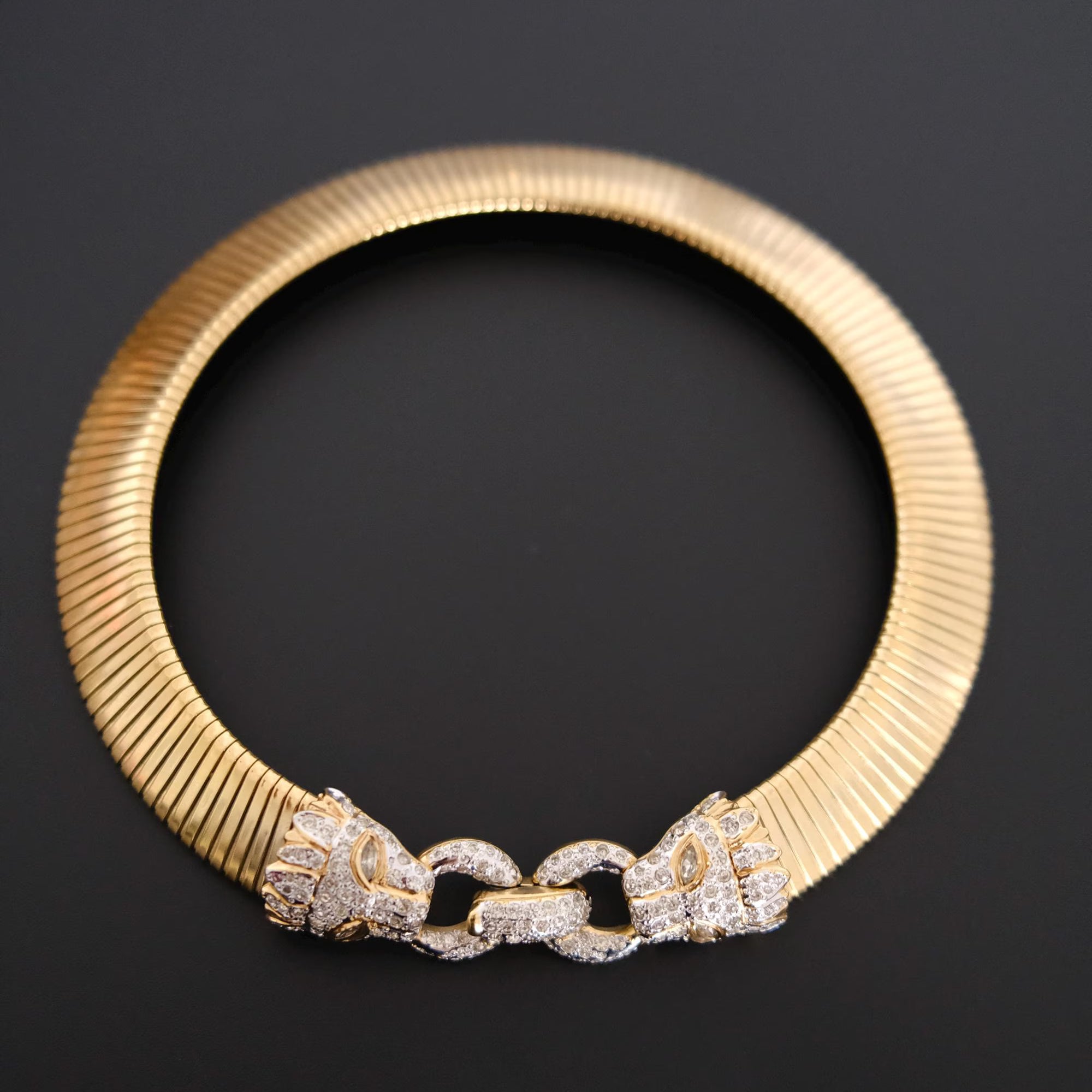 Vintage Vogue Bijoux gold-tone collar choker with two crystal pavé feline heads and hidden front closure