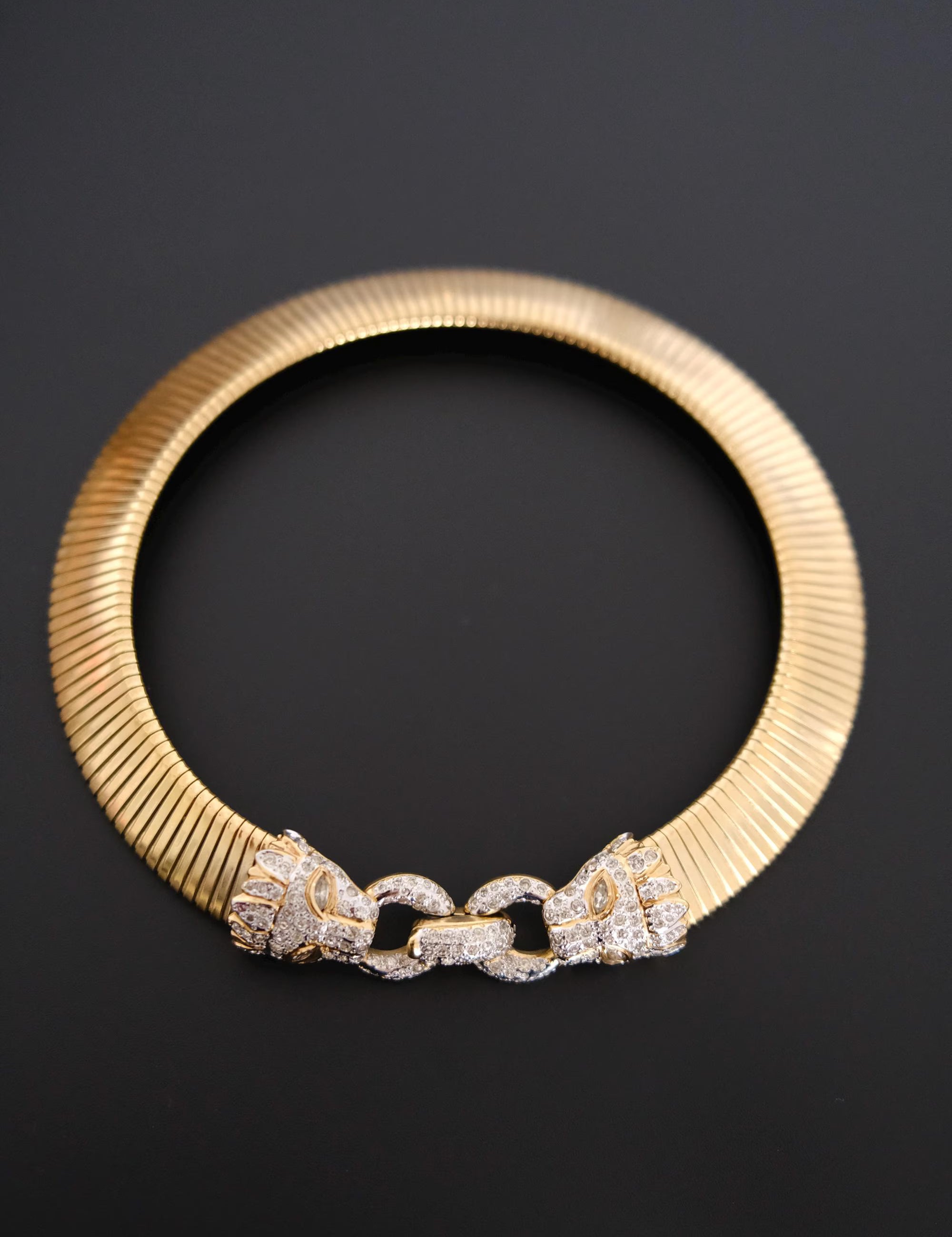 Vintage Vogue Bijoux gold-tone collar choker with two crystal pavé feline heads and hidden front closure