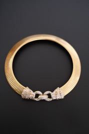Vintage Vogue Bijoux gold-tone collar choker with two crystal pavé feline heads and hidden front closure