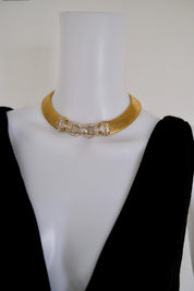 Vintage Vogue Bijoux gold-tone collar choker with two crystal pavé feline heads and hidden front closure