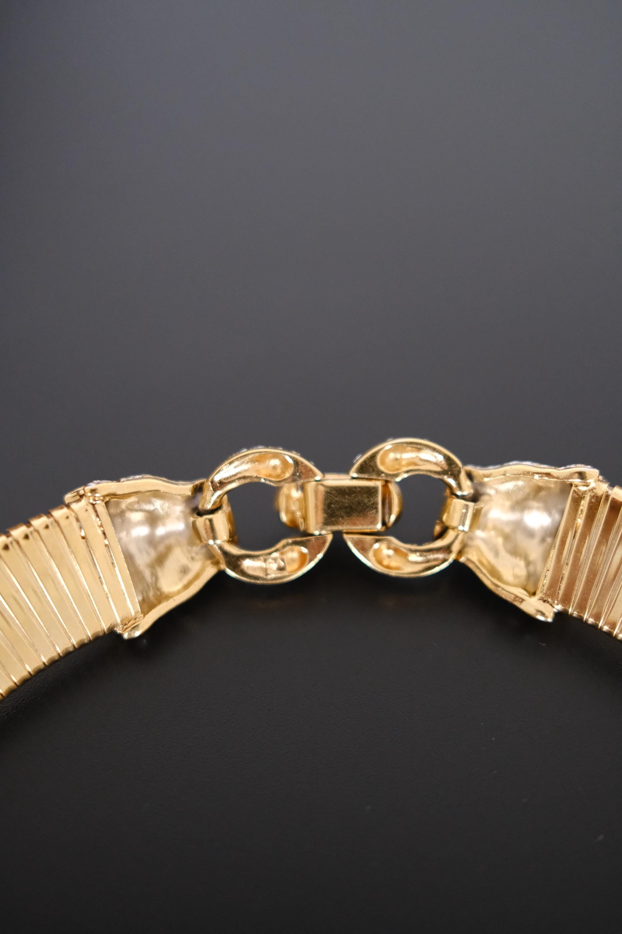 Vintage Vogue Bijoux gold-tone collar choker with two crystal pavé feline heads and hidden front closure