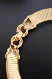 Vintage Vogue Bijoux gold-tone collar choker with two crystal pavé feline heads and hidden front closure