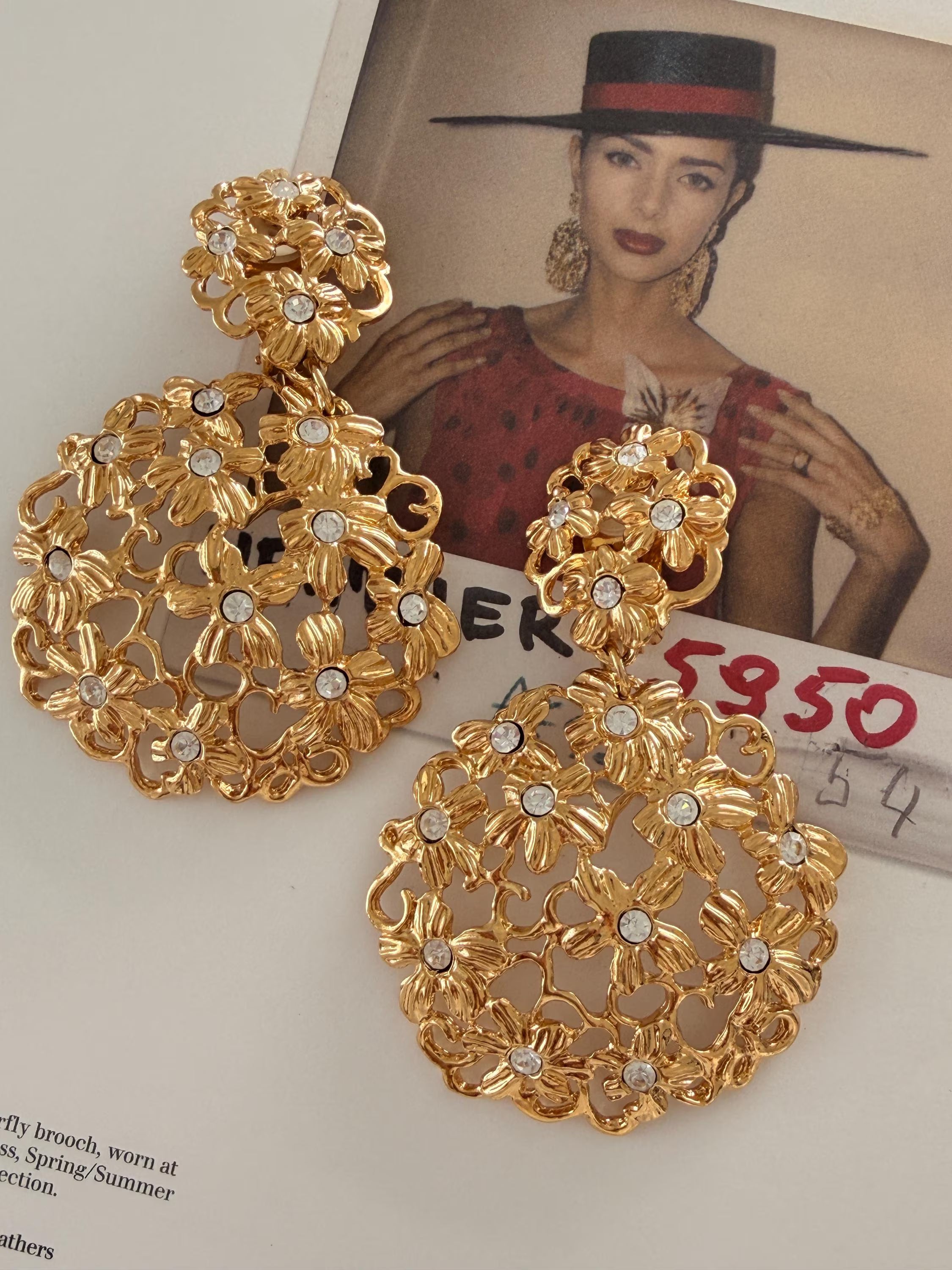 Luxury vintage YSL gold floral statement earrings with rhinestones for elegant women