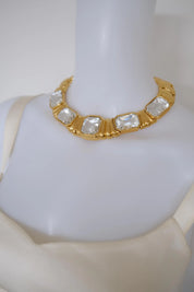 Vintage Yves Saint Laurent crystal statement choker worn closely around the neckline with oversized geometric stones