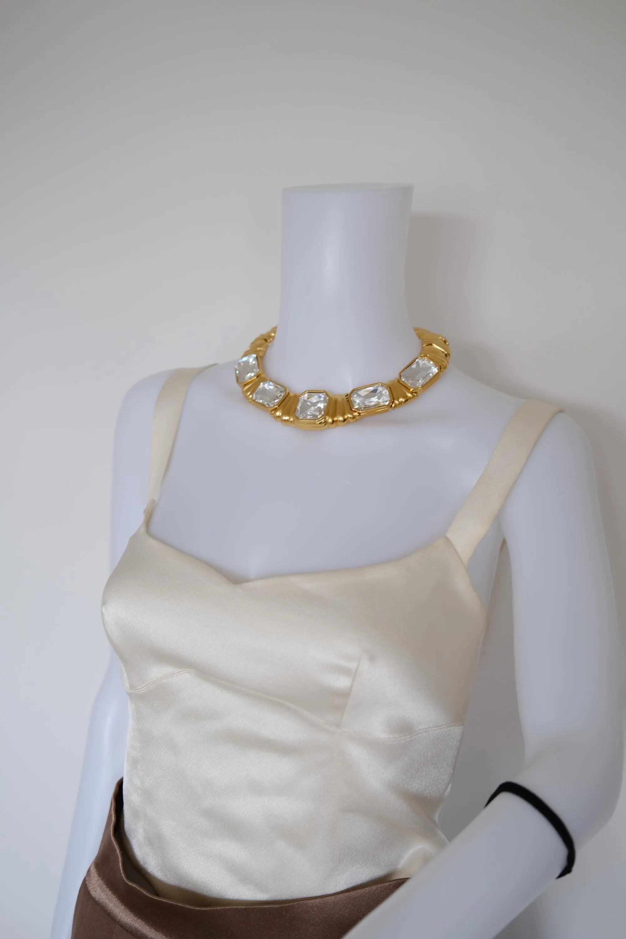 Vintage Yves Saint Laurent crystal statement choker worn closely around the neckline with oversized geometric stones