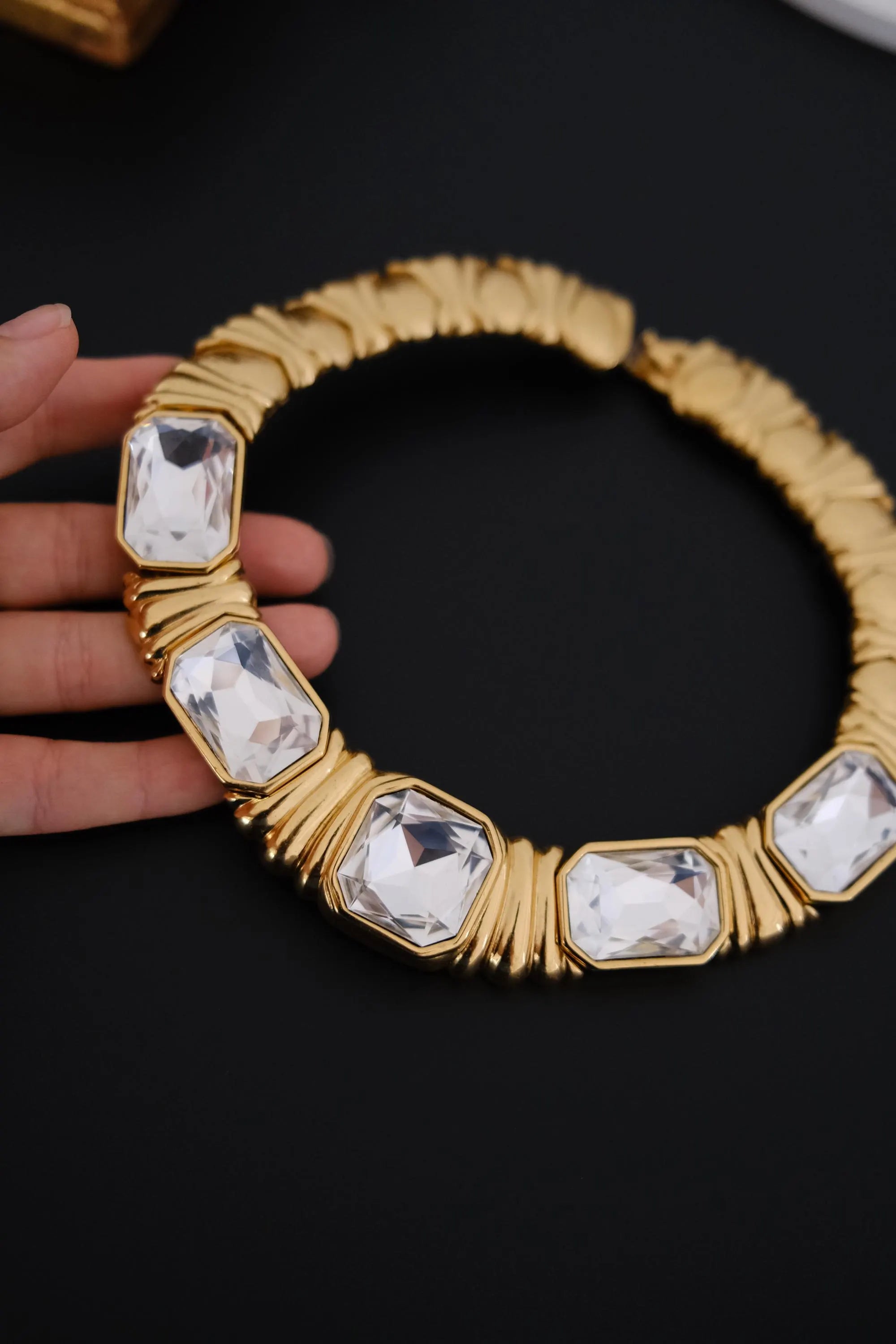 Excellent vintage condition Yves Saint Laurent gold-tone crystal choker showing bright faceted stones and polished metal finish