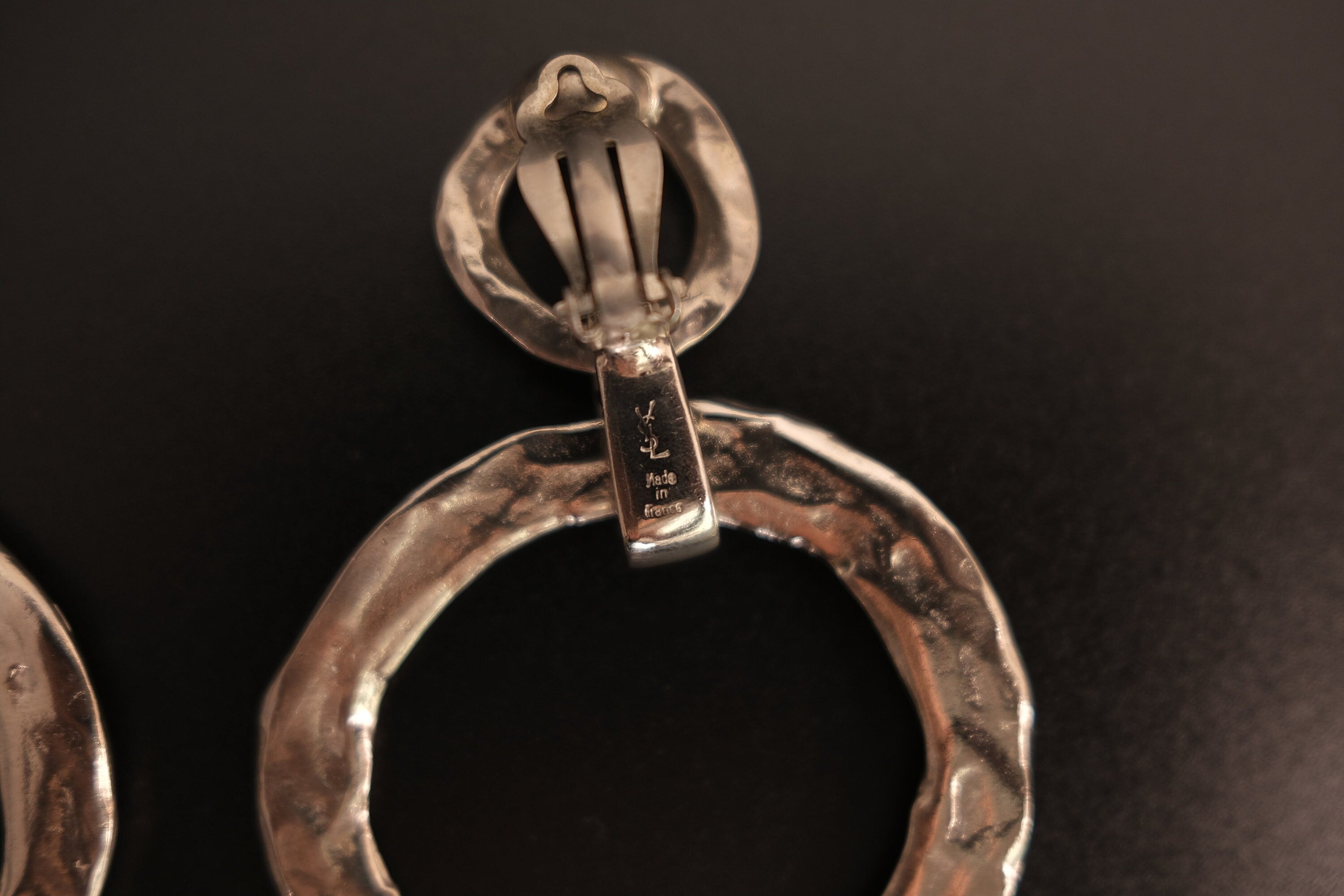 Vintage Yves Saint Laurent Hoop Earrings Close Up Showing YSL Signature on Clip Backs