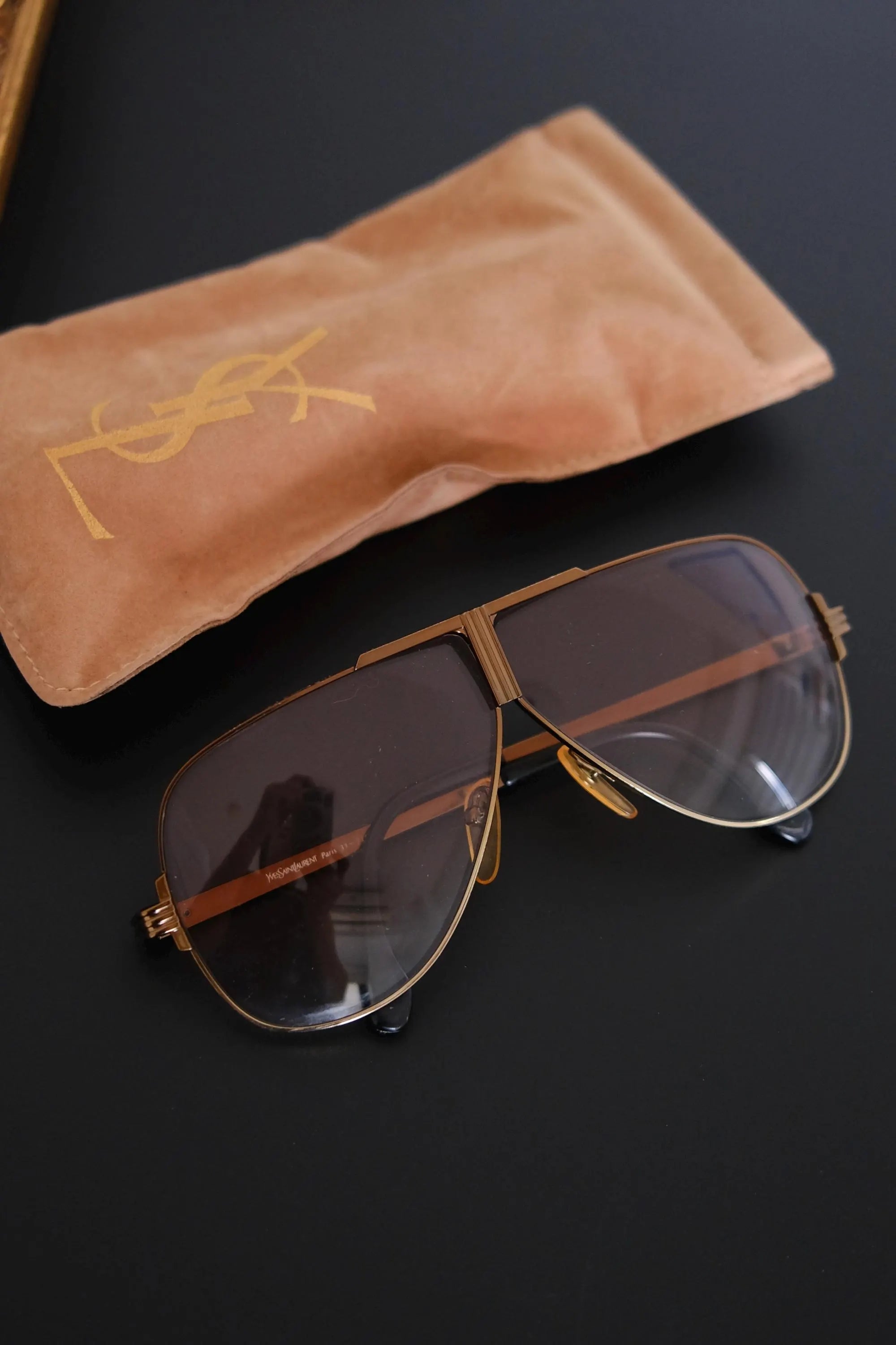 Rare vintage YSL Paris 31-211 aviator sunglasses with architectural metal frame styled for editorial fashion photography