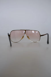 Close-up of distinctive architectural brow bar and double bridge construction on vintage YSL aviator sunglasses