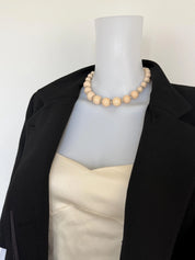 Yves Saint Laurent vintage beige crystal beaded choker necklace styled with a tailored blazer