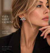 Vintage Yves Saint Laurent YSL crystal heart earrings worn on ear