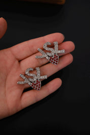 Vintage Yves Saint Laurent crystal logo earrings with red crystal heart detail