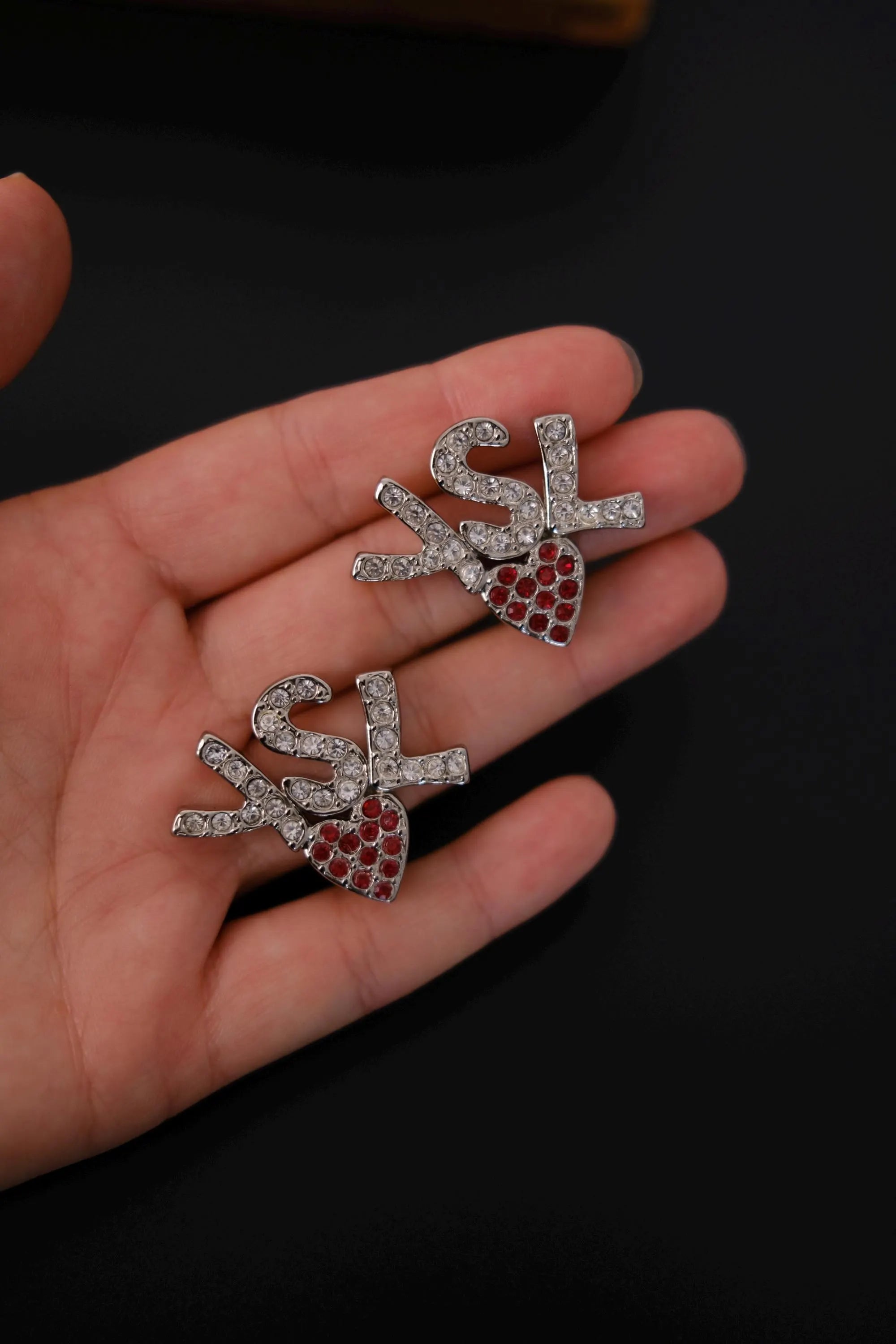 Vintage Yves Saint Laurent crystal logo earrings with red crystal heart detail