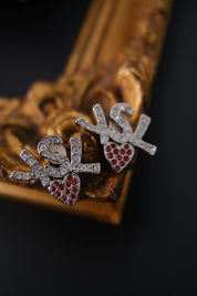 Vintage Yves Saint Laurent YSL crystal heart logo clip-on earrings