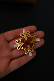 Front view of vintage Yves Saint Laurent YSL cabochon and faux pearl statement brooch
