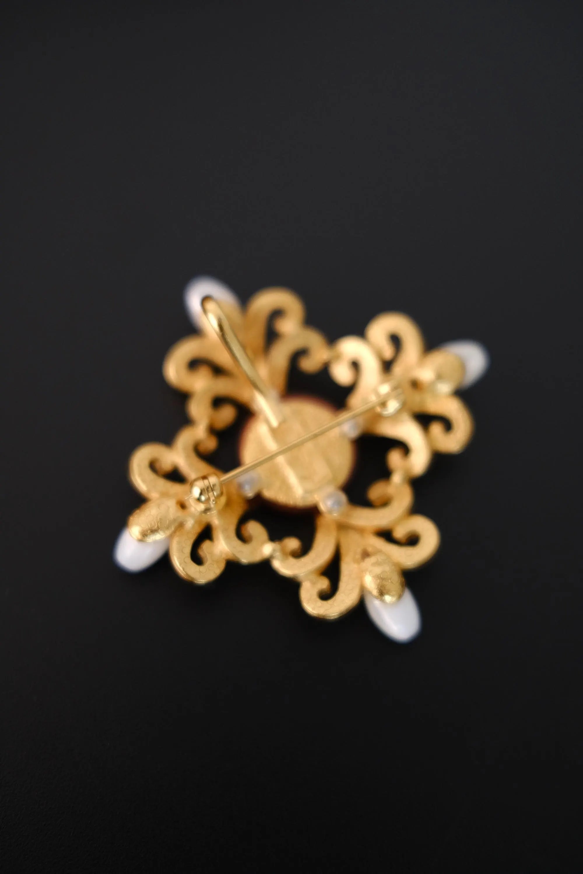 Reverse of vintage Yves Saint Laurent YSL brooch with pin closure