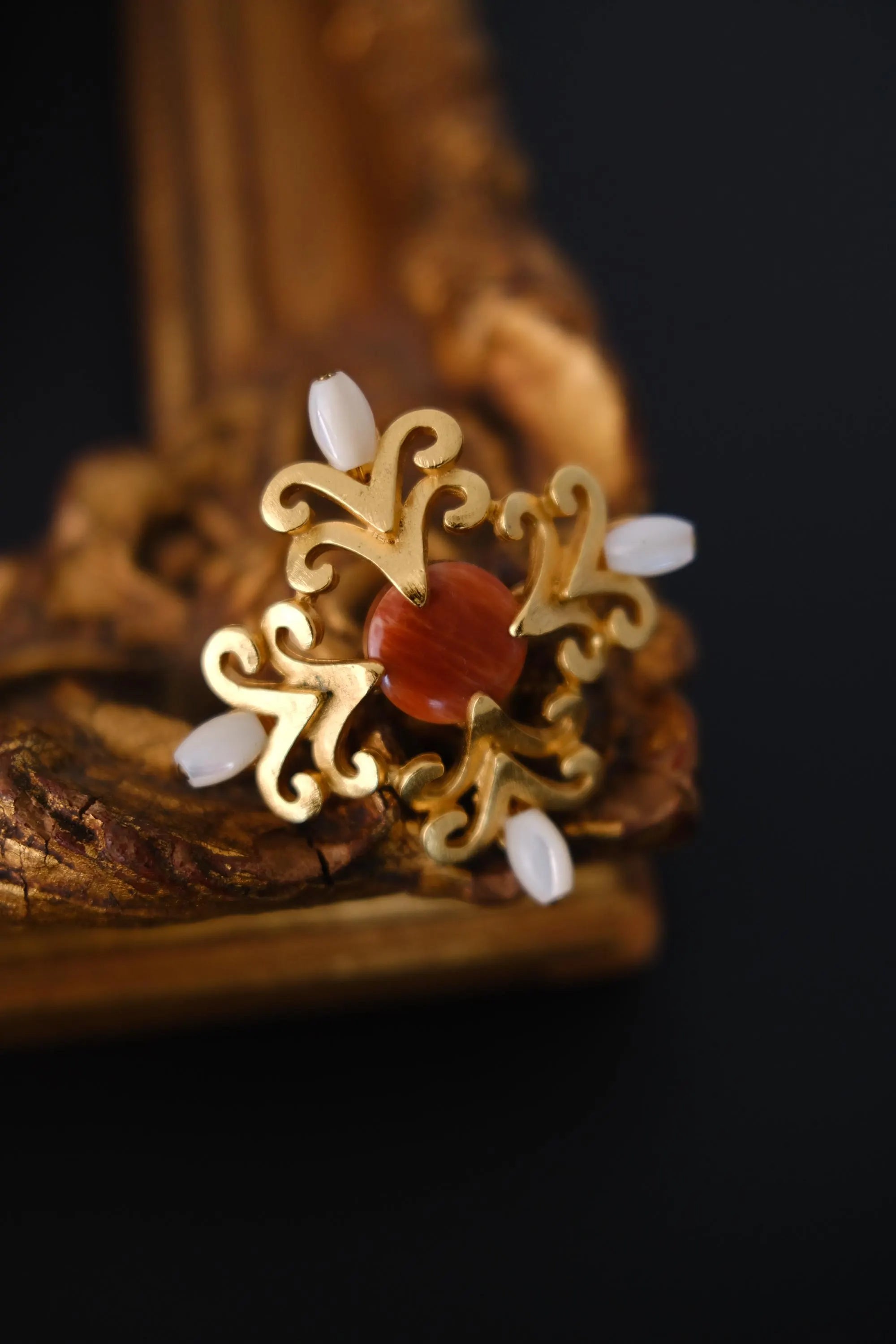 Front view of vintage Yves Saint Laurent YSL cabochon and faux pearl statement brooch